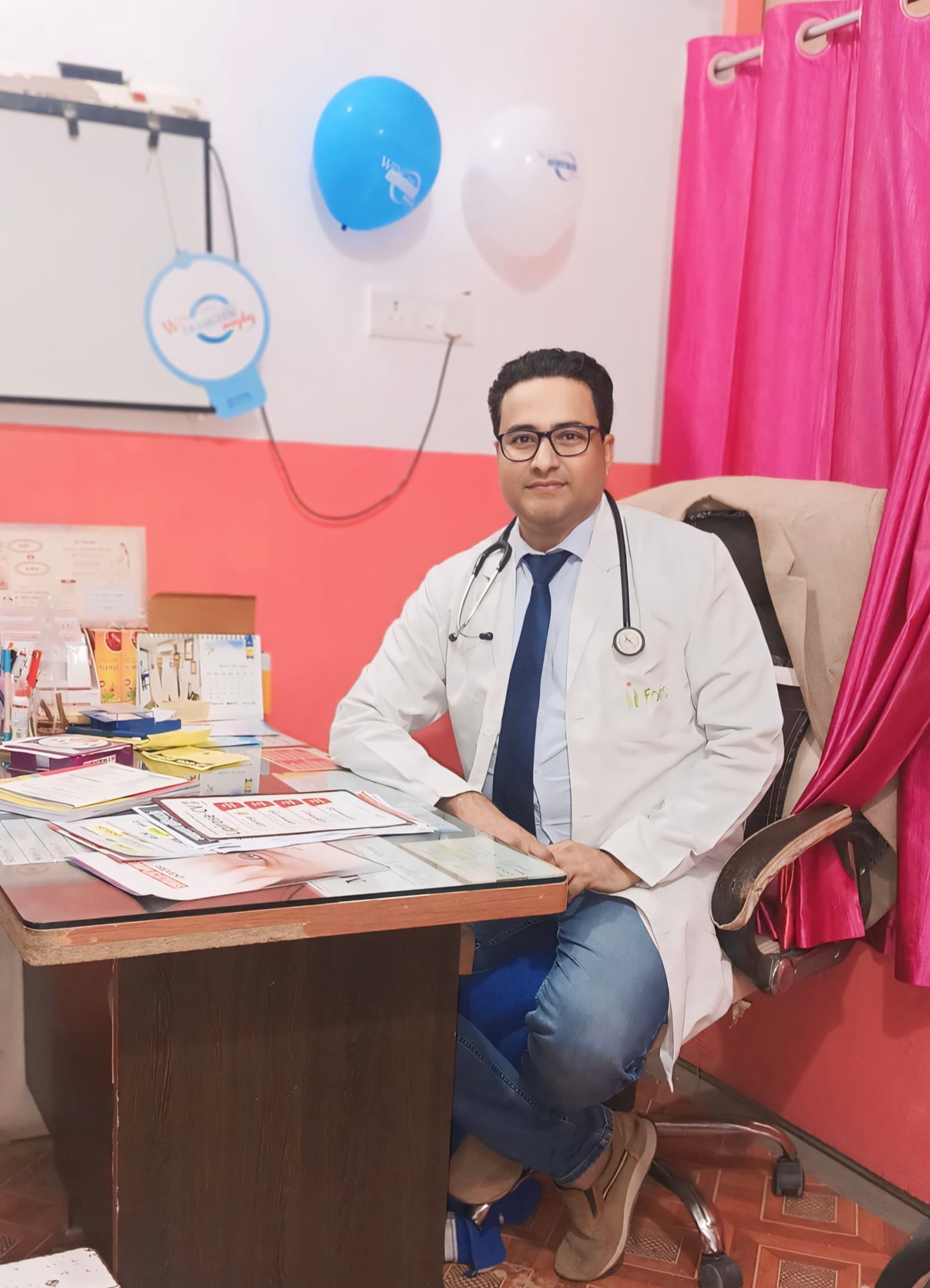Inside Dr. S. Hussain's Siwan clinic consultation room Interior of Dr. S. Hussain's Siwan clinic consultation room with doctor seated at patient desk