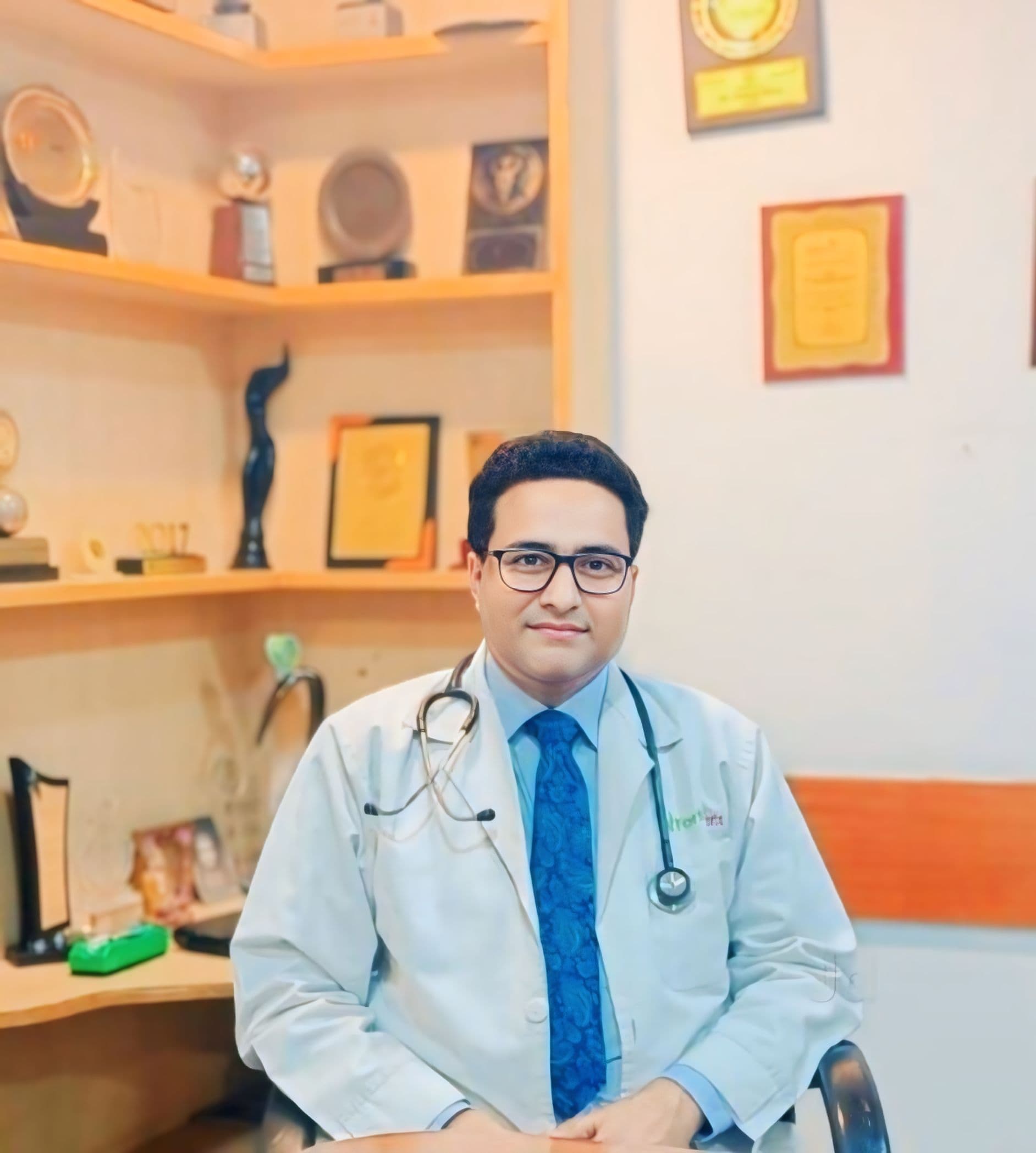 Dr. S. Hussain — award-winning physician and diabetologist in Siwan, Bihar Dr. S. Hussain, physician & diabetologist in Siwan Bihar, professional clinic portrait with awards on display