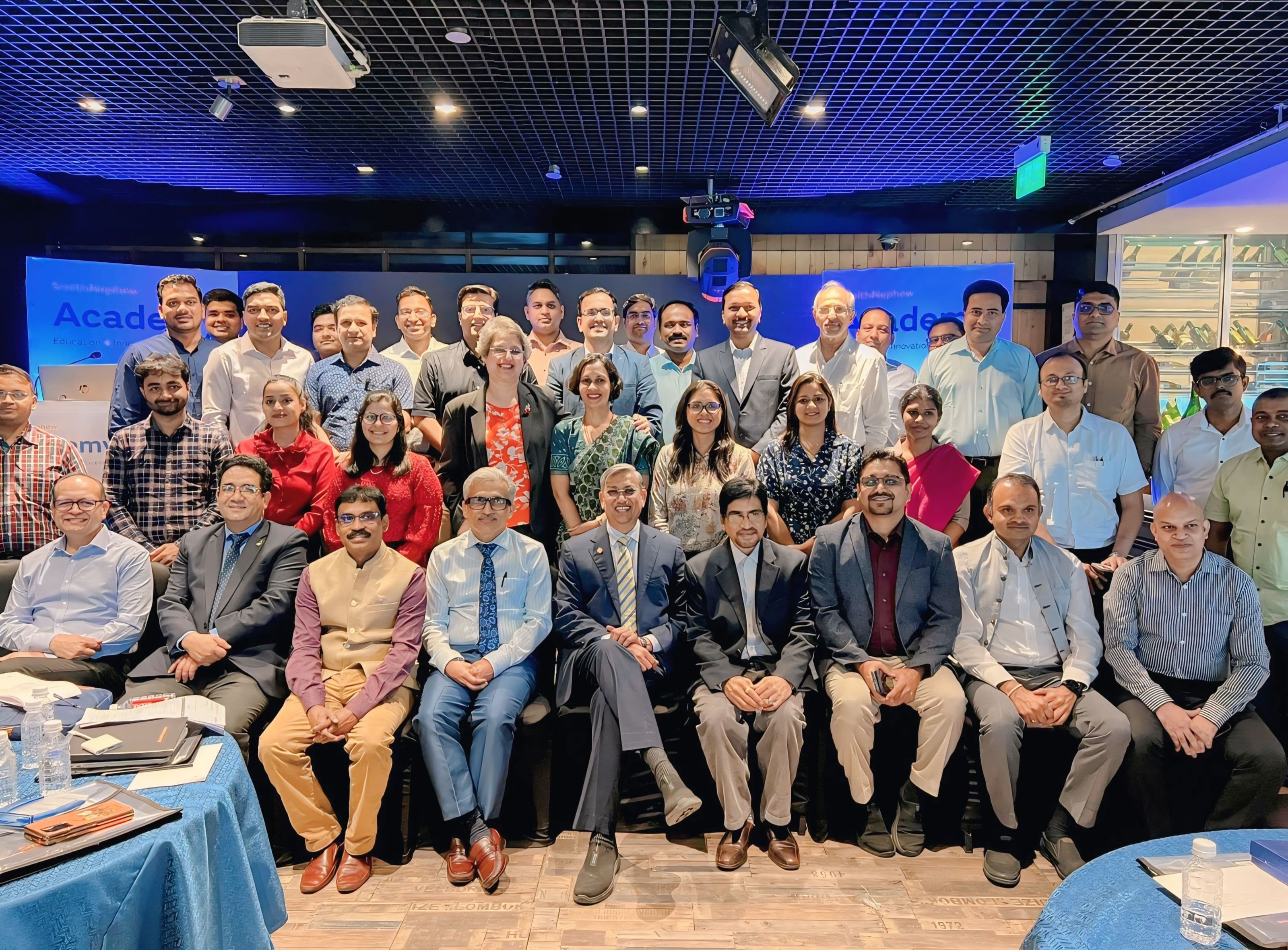 Dr. S. Hussain at CME workshop group photo with senior physician faculty Dr. S. Hussain with senior physicians at a Continuing Medical Education (CME) workshop group portrait